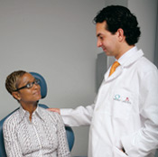 Woman Patient consults with Male Doctor about Mastopexy