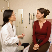Woman talking with Female Doctor about Breast Augmentation